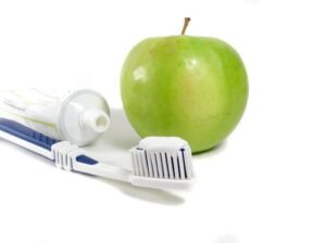 Toothbrush and apple